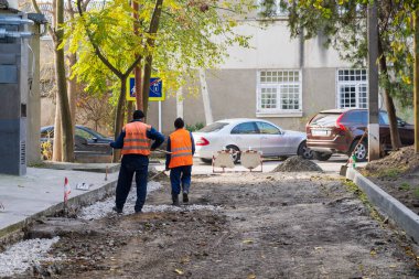 Road workers. Repair of intra-yard or intra-quarter roads, background. November 4, 2022 Beltsy Moldova