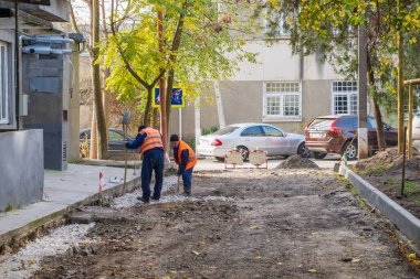 Road workers. Repair of intra-yard or intra-quarter roads, background. November 4, 2022 Beltsy Moldova