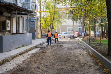 Road workers. Repair of intra-yard or intra-quarter roads, background. November 4, 2022 Beltsy Moldova