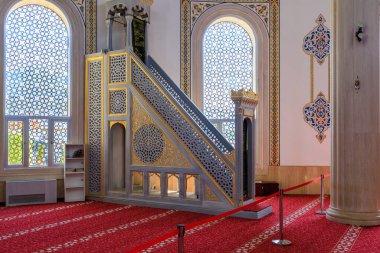 Interior in the mosque HUZUR. City landmark open to tourists. Classic Islamic background. August 9, 2022 Kemer, Antalya province, Turkey.