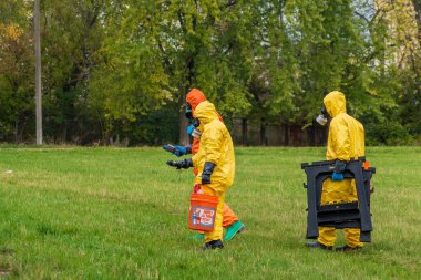 People in chemical protection suits are looking for a source of radiation contamination. Radiation and Chemical Protection. October 12, 2022 Balti Moldova.