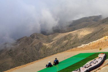 Thrill-seekers on the top of Mount Tahtali. Illustrative editorial. August 9, 2022 mountain near Kemer, Antalya province, Turkey