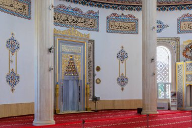 Interior in the mosque HUZUR. City landmark open to tourists. Classic Islamic background. August 9, 2022 Kemer, Antalya province, Turkey.