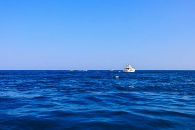 Yacht or boat on the high seas. Background with copy space. August 9, 2022 Kemer, Antalya province, Turkey.