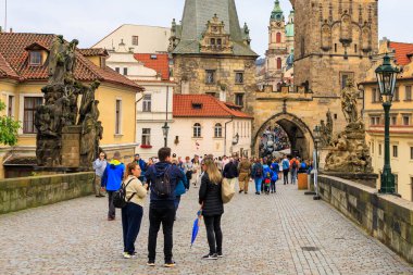 August 24, 2022 Prague, Czech Republic. Pedestrian Charles Bridge. Background with copy space for text.