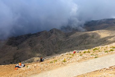 Thrill-seekers on the top of Mount Tahtali. Illustrative editorial. August 9, 2022 mountain near Kemer, Antalya province, Turkey