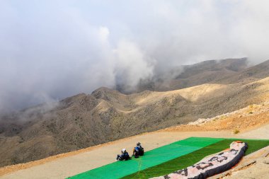 Thrill-seekers on the top of Mount Tahtali. Illustrative editorial. August 9, 2022 mountain near Kemer, Antalya province, Turkey