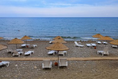 August 11, 2022 Beldibi, Kemer district, Antalya Province, Turkey. City public beach. Background with copy space for text