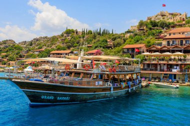 August 10, 2022 Demre, Antalya province, Turkey. Yachts near the Turkish rocky shore. Background with copy space for text