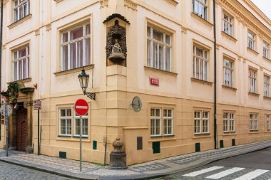 August 25, 2022 Prague, Czech Republic. Ancient sculpture in urban architecture. Background with selective focus and copy space