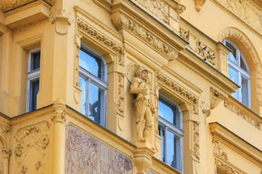 August 27, 2022 Prague, Czech Republic. Ancient sculpture in urban architecture. Background with selective focus and copy space
