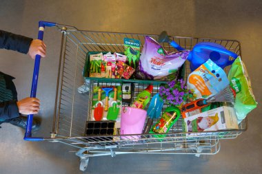 A full shopping cart of a customer in a supermarket with goods for the garden. February 17, 2022 Beltsy Moldova.
