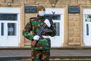 February 12, 2022 Balti Moldova. Soldier of the guard of honor on duty in an urban environment. Background