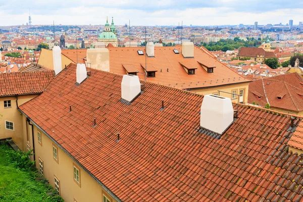 Roofs of houses and a view of the city of Prague. Background with selective focus and copy space for text
