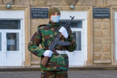 February 12, 2022 Balti Moldova. Soldier of the guard of honor on duty in an urban environment. Background