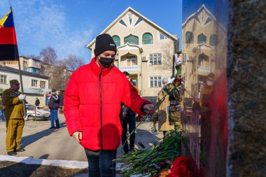 February 15, 2022 Balti Moldova. Laying flowers at the monument to the soldiers who died in Afghanistan on a memorial day