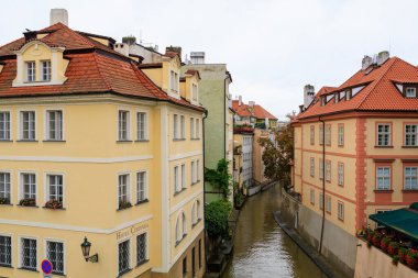 August 24, 2022 Prague, Czech Republic. Houses of classical European architecture with a river channel. Background with copy space for text.