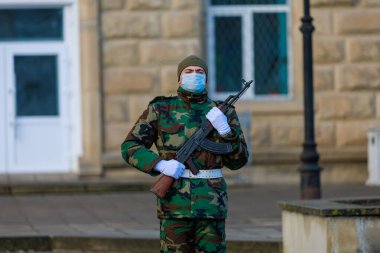 February 12, 2022 Balti Moldova. Soldier of the guard of honor on duty in an urban environment. Background