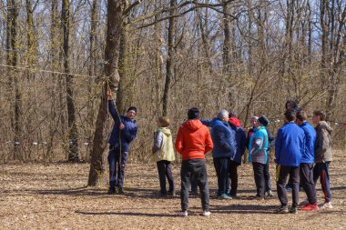 March 27, 2022 Mindrestii Moldova. Tourists amateurs at the training camp in the forest. News editorial background