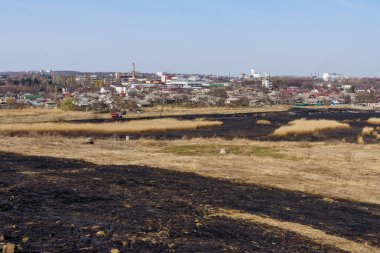 March 29, 2022 Balti Moldova. Editorial background for news. Burnt reeds after a fire near the village