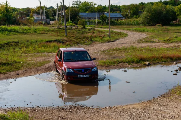 stock image August 22, 2021 Koban Moldova, the car crosses a huge stream or a small river. Illustrative editorial. Background with copy space