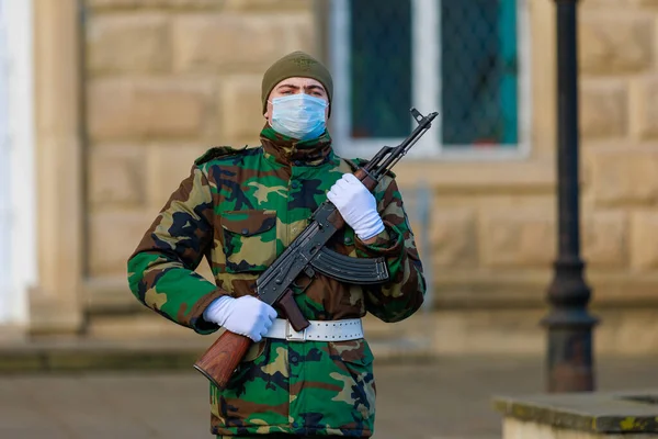 February 12, 2022 Balti Moldova. Soldier of the guard of honor on duty in an urban environment. Background