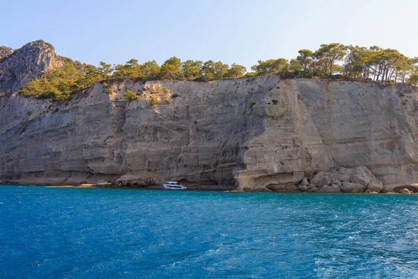 Sea mountain coast of the Mediterranean Sea in the coastal zone of the city and port. Background with copy space. August 9, 2022 Kemer, Antalya province, Turkey.