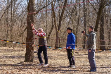 March 27, 2022 Mindrestii Moldova. Amateur tourists train in the forest outside the city. News editorial background