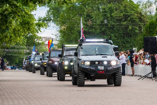 stock image May 22, 2022 Beltsy, Moldova. Illustrative editorial. Club of fans of SUVs at the city parade