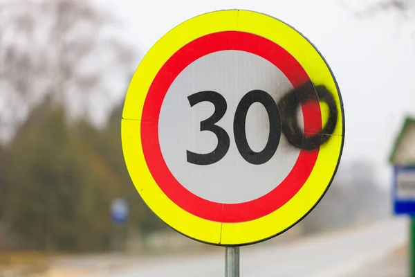 stock image The vandals painted the number zero on a road sign with a speed limit of 30 kilometers per hour. 300 kilometers per hour sign background