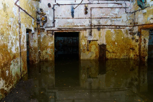 The flooded level of a secret abandoned military bunker. Background with selective focus