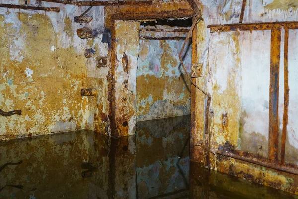 stock image The flooded level of a secret abandoned military bunker. Background with selective focus