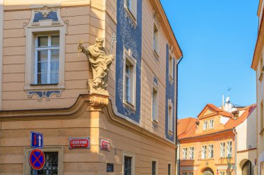 August 27, 2022 Prague, Czech Republic. Ancient sculpture in urban architecture. Background with selective focus and copy space