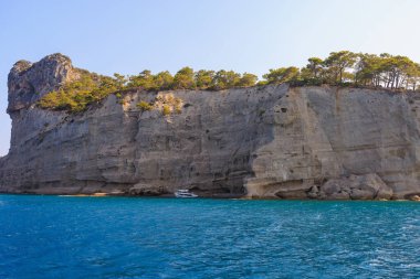 Sea mountain coast of the Mediterranean Sea in the coastal zone of the city and port. Background with copy space. August 9, 2022 Kemer, Antalya province, Turkey.