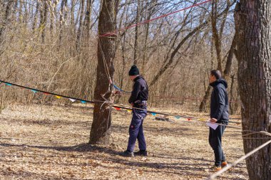 March 27, 2022 Mindrestii Moldova. Amateur tourists train in the forest outside the city. News editorial background
