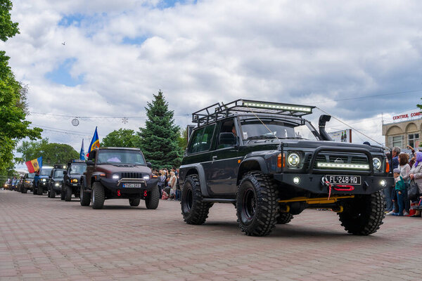 May 22, 2022 Beltsy, Moldova. Illustrative editorial. Club of fans of SUVs at the city parade