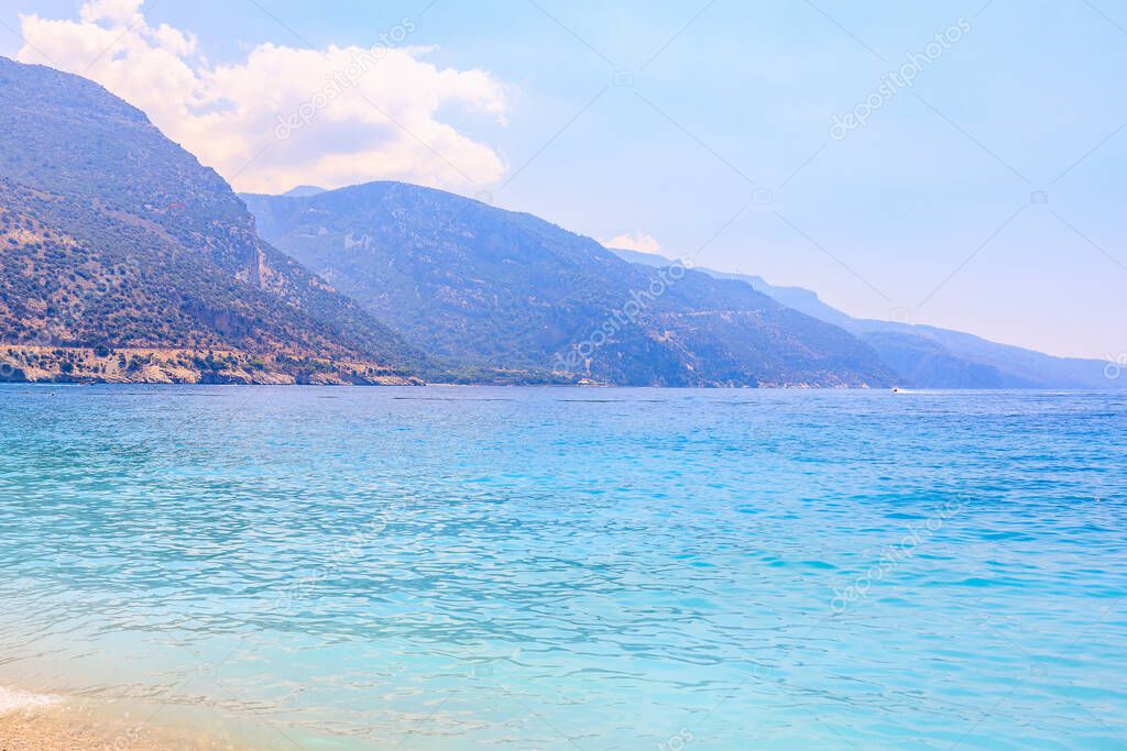 View of the mountains and the sea from Oludeniz beach, the blue lagoon. The cleanest beach with a blue flag. Background