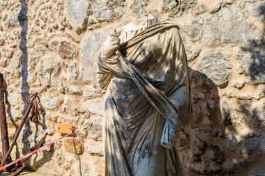 Fragments of an antique statue or sculpture made of marble. Background with selective focus and copy space for text.