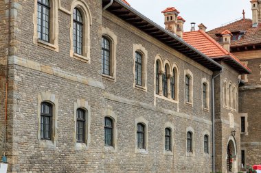 Brick building with a red roof, Cantacuzino Castle. December 15, 2024 Busteni Romania. clipart