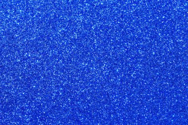 Bir sürü küçük mavi noktalı mavi bir arka plan. Noktalar her yere dağılmış ve farklı boyutlarda.