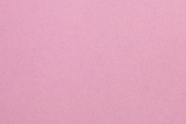 Ortasında beyaz bir nesne olan pembe bir arka plan. Nesne, beyaz kenarlıklı, dokulu origami kağıt zeminli küçük bir kare.