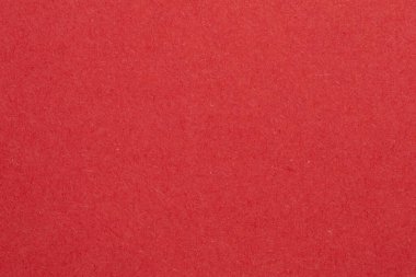 Ortasında beyaz bir nesne olan kırmızı bir arkaplan. Nesne, beyaz kenarlıklı, dokulu origami kağıt zeminli küçük bir kare.