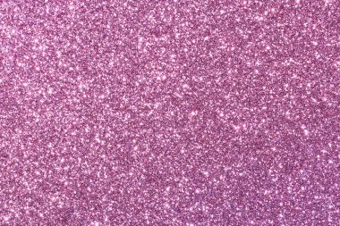 Pembe bir arka plan ve parlak bir doku. Parıltı tüm arka plana saçılmış.