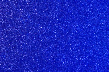 Bir sürü küçük mavi noktalı mavi bir arka plan. Noktalar her yere dağılmış.