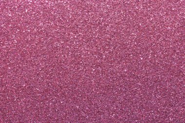 Pembe bir arka plan ve parlak bir doku. Parıltı tüm arka plana saçılmış.