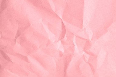 Buruşmuş pembe kağıt dokusu kıvrımlı ve buruşuk.