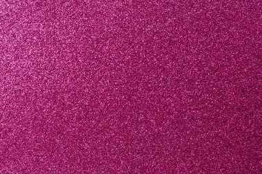 Pembe arka planda bir sürü küçük pembe nokta etrafa saçılmış. Arka plan pembenin koyu tonu, noktalar pembenin açık tonu. Görüntü çok neşeli.