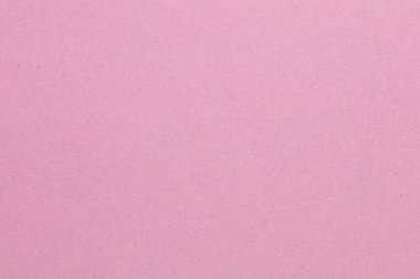 Ortasında beyaz bir nesne olan pembe bir arka plan. Nesne, beyaz kenarlıklı, dokulu origami kağıt zeminli küçük bir kare.