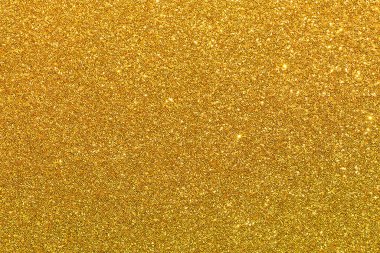 Bir sürü parıltısı olan altın bir arka plan. Altın parıldıyor ve parıldıyor.