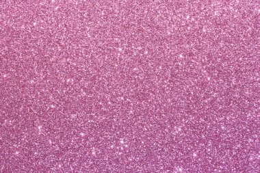 Pembe bir arka plan ve parlak bir doku. Parıltı tüm arka plana saçılmış.